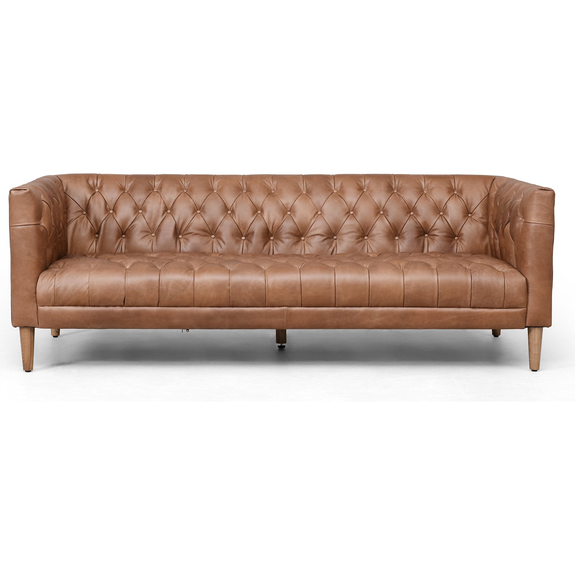 Williams Leather Sofa by Four Hands. Made from top grain leather, solid ash, 100% polyester in a rustic style.
