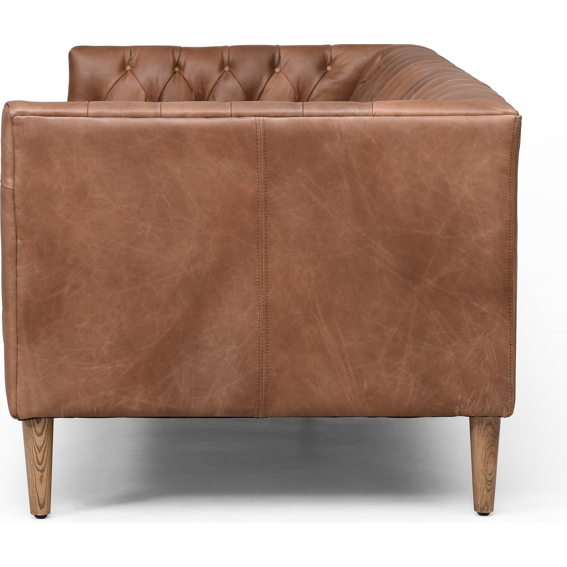 Williams Leather Sofa by Four Hands. Made from top grain leather, solid ash, 100% polyester in a rustic style.
