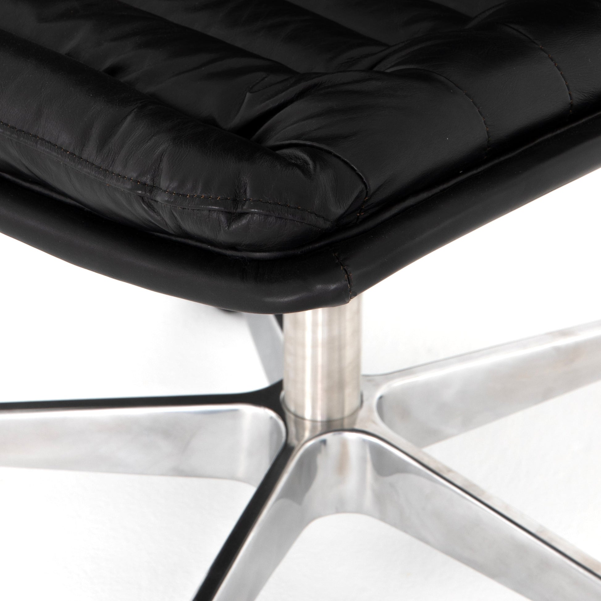Malibu Desk Chair by Four Hands in rider black. Made from top grain leather, aluminum, 100% polyester in a modern style.