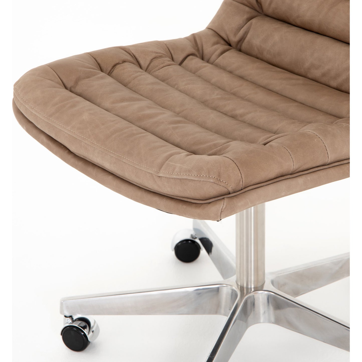 047 SI-1901022 | Closeup | Malibu Desk Chair by Four Hands. Made from top grain leather, aluminum, 100% polyester in a modern style.