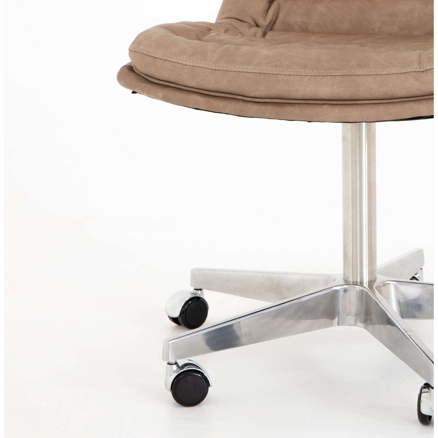 051 SI-1901022 | Closeup | Malibu Desk Chair by Four Hands. Made from top grain leather, aluminum, 100% polyester in a modern style.