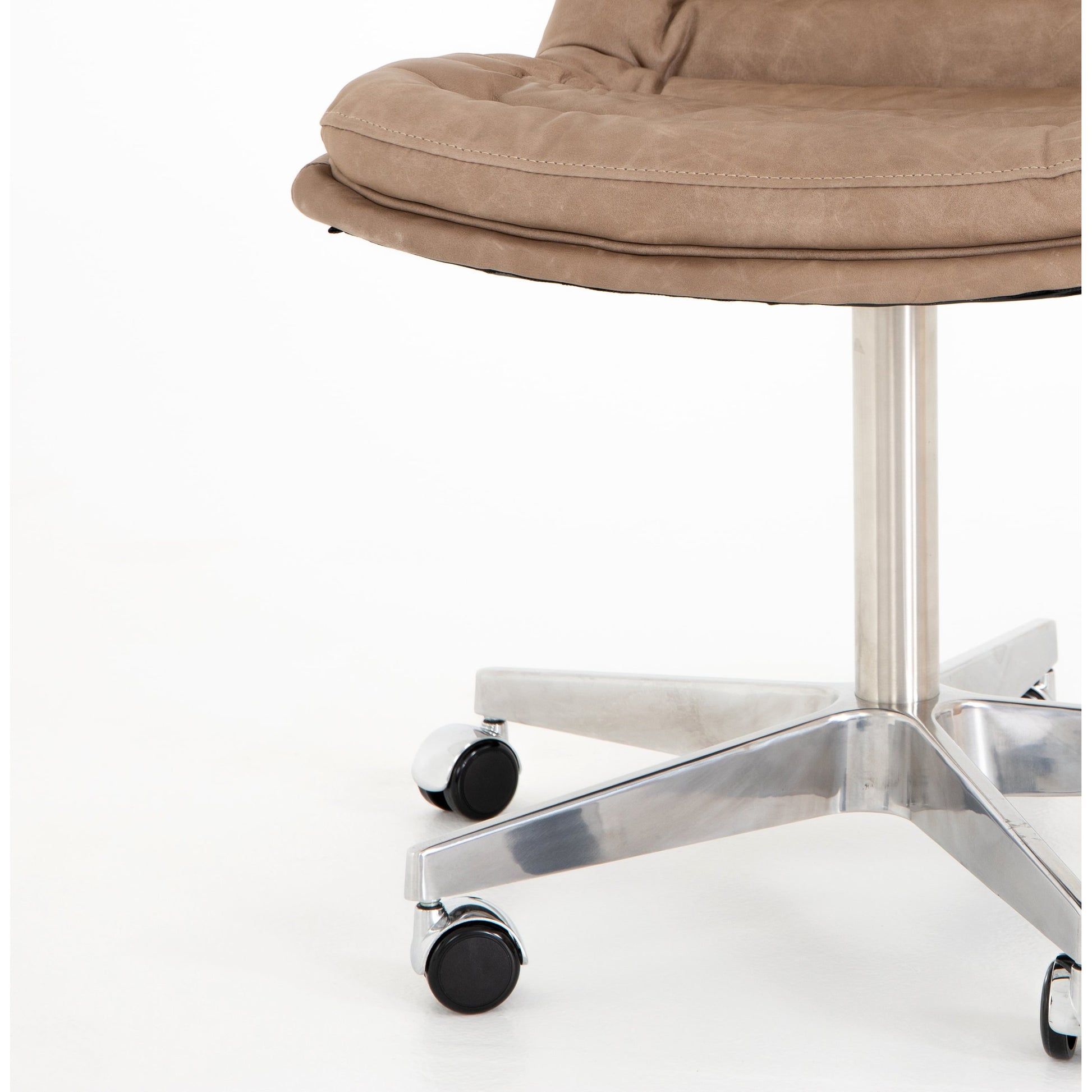 Malibu Desk Chair by Four Hands in rider black. Made from top grain leather, aluminum, 100% polyester in a modern style.