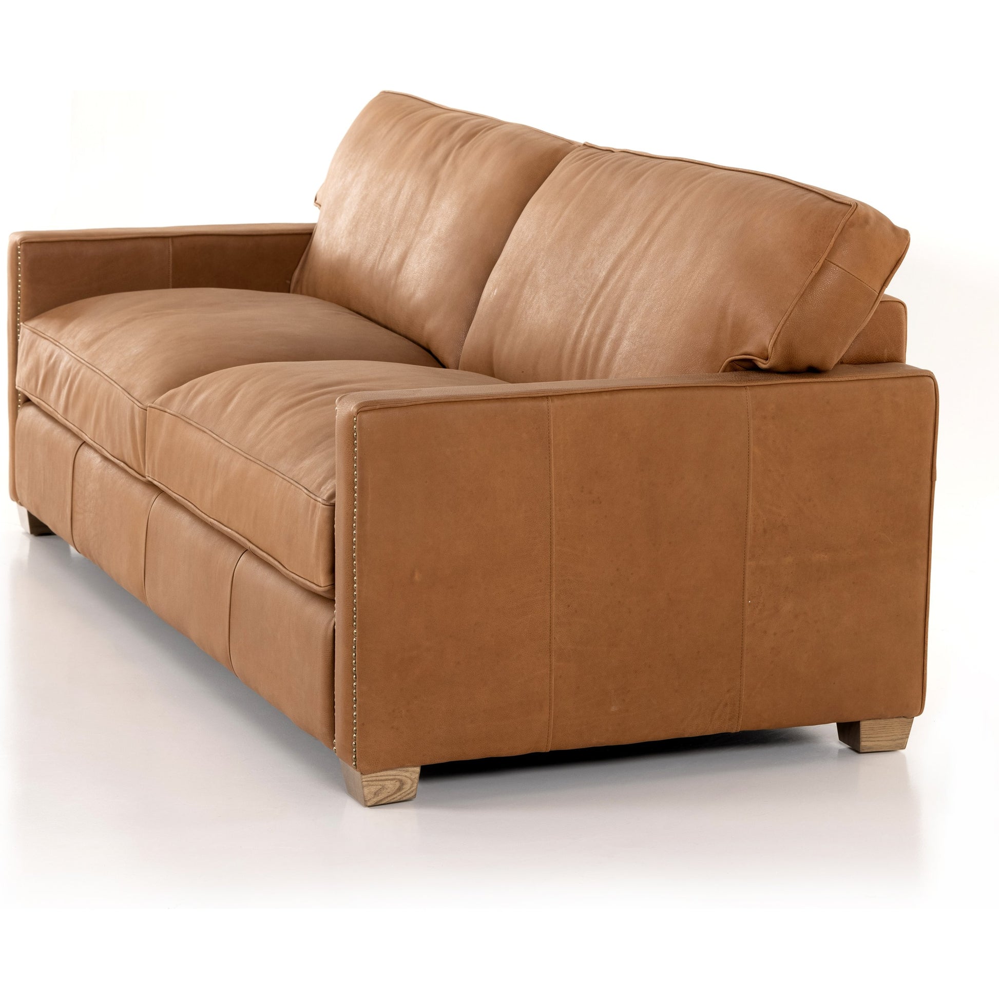 Larkin Sofa by Four Hands in cigar, antique oak, antique brass nailhead. Made from top grain leather, solid ash, iron in a modern style.