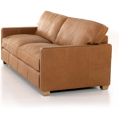 Larkin Sofa by Four Hands in cigar, antique oak, antique brass nailhead. Made from top grain leather, solid ash, iron in a modern style.