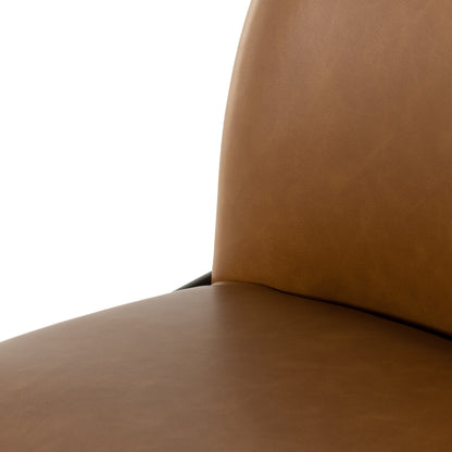 Astrud Bar Stool by Four Hands in sierra butterscotch. Made from faux leather, iron, top grain leather in a modern style.