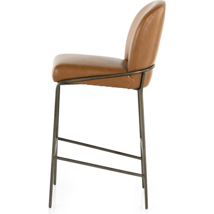 Astrud Bar Stool by Four Hands in sierra butterscotch. Made from faux leather, iron, top grain leather in a modern style.