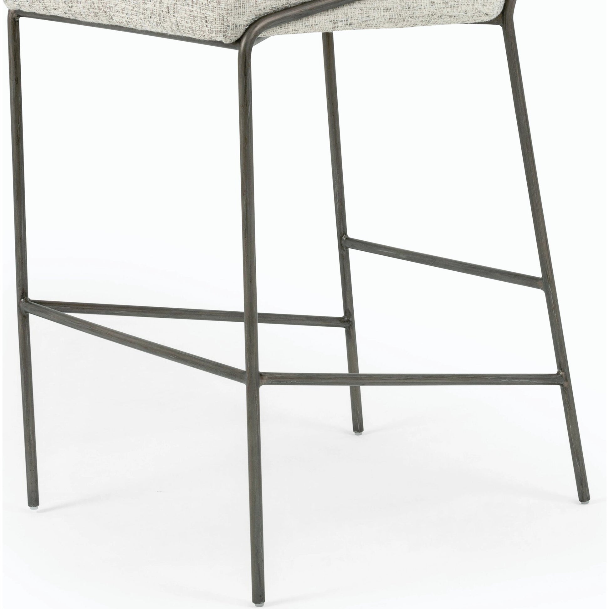 Astrud Bar Stool by Four Hands in sierra butterscotch. Made from faux leather, iron, top grain leather in a modern style.