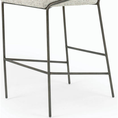 Astrud Bar Stool by Four Hands in sierra butterscotch. Made from faux leather, iron, top grain leather in a modern style.