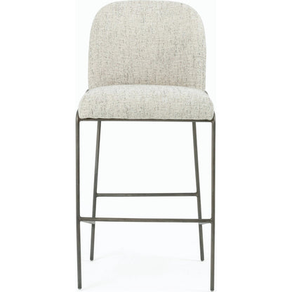 Astrud Bar Stool by Four Hands in sierra butterscotch. Made from faux leather, iron, top grain leather in a modern style.