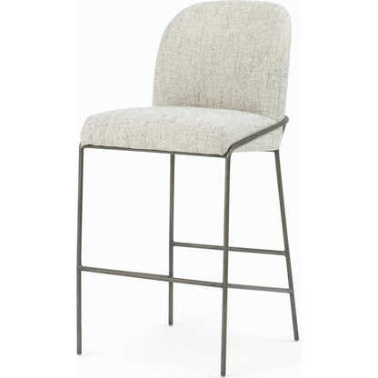 Astrud Bar Stool by Four Hands in sierra butterscotch. Made from faux leather, iron, top grain leather in a modern style.