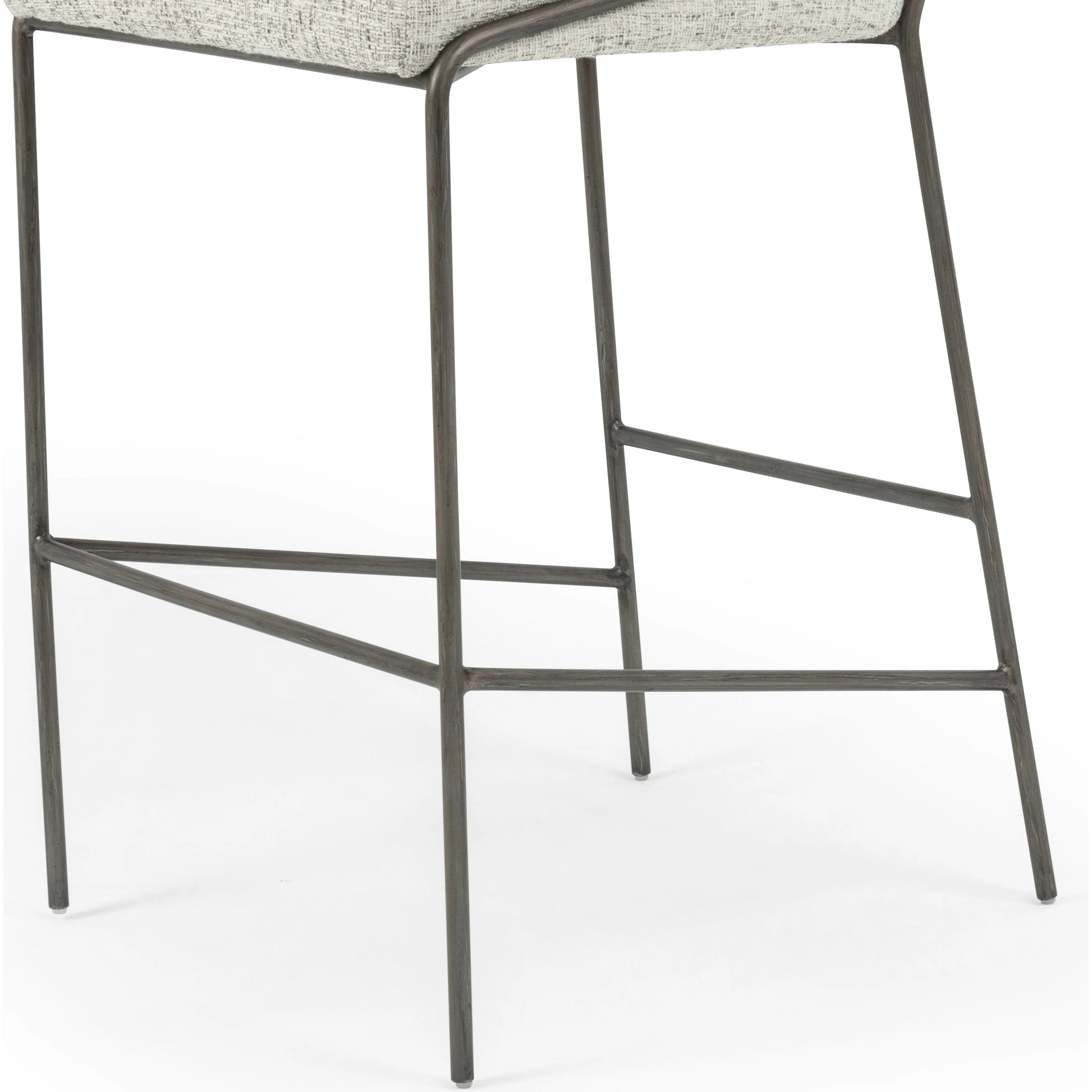 Astrud Bar Stool by Four Hands in sierra butterscotch. Made from faux leather, iron, top grain leather in a modern style.