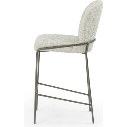 Astrud Bar Stool by Four Hands in sierra butterscotch. Made from faux leather, iron, top grain leather in a modern style.