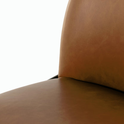 Astrud Bar Stool by Four Hands in sierra butterscotch. Made from faux leather, iron, top grain leather in a modern style.