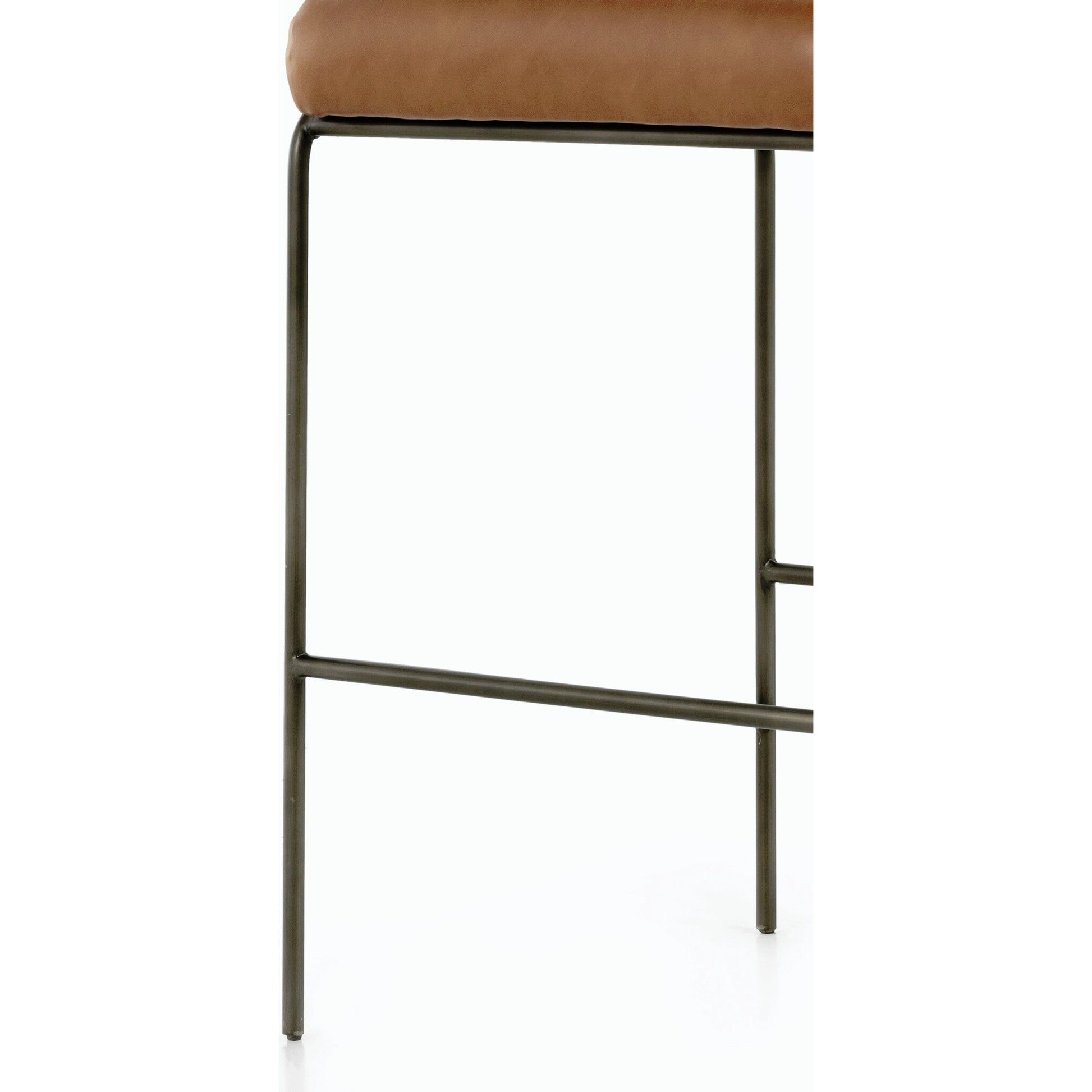 Astrud Bar Stool by Four Hands in sierra butterscotch. Made from faux leather, iron, top grain leather in a modern style.