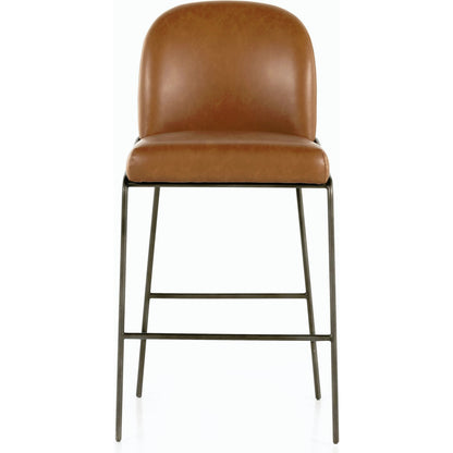 Astrud Bar Stool by Four Hands in sierra butterscotch. Made from faux leather, iron, top grain leather in a modern style.