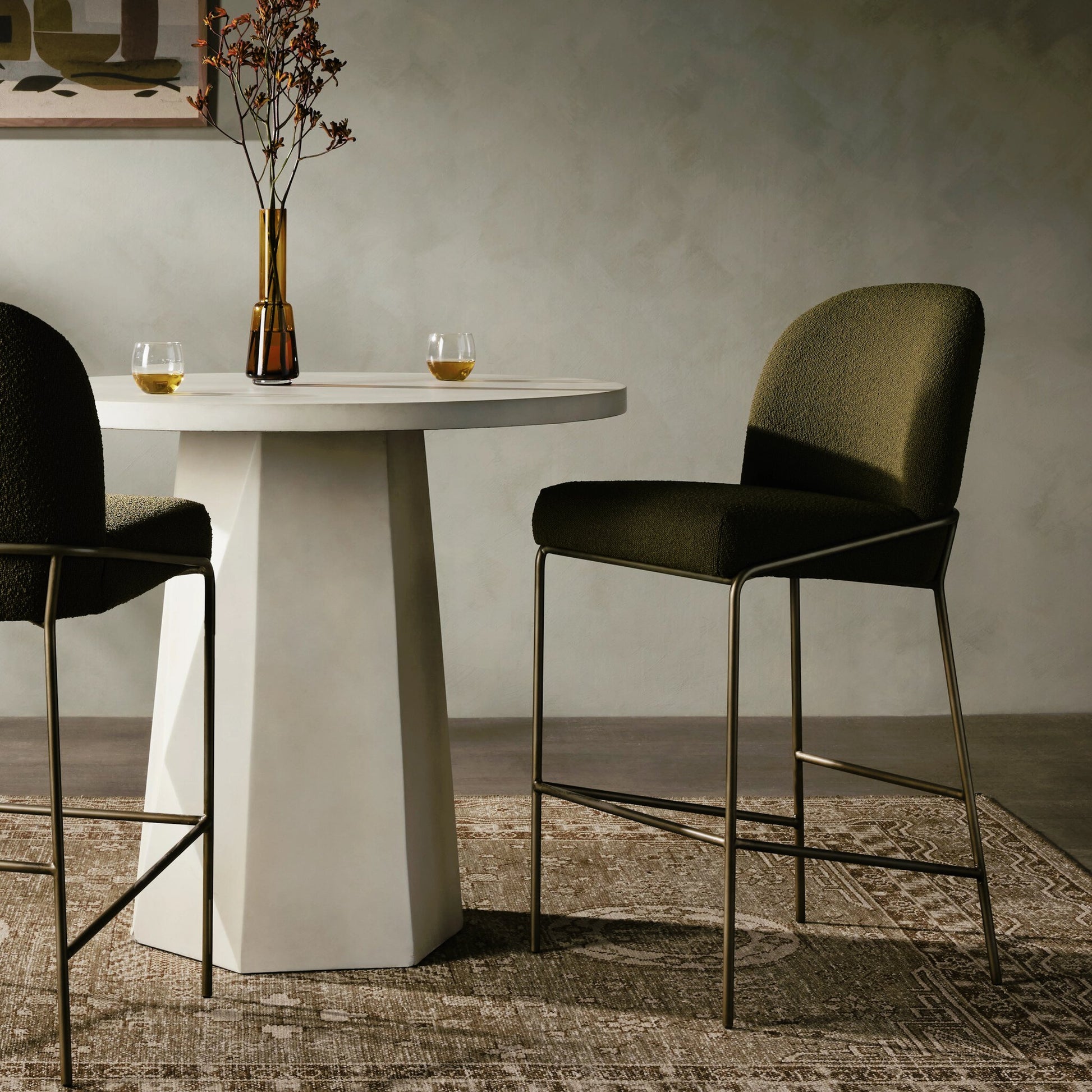 Astrud Bar Stool by Four Hands in sierra butterscotch. Made from faux leather, iron, top grain leather in a modern style.