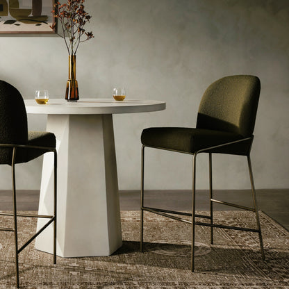 Astrud Bar Stool by Four Hands in sierra butterscotch. Made from faux leather, iron, top grain leather in a modern style.