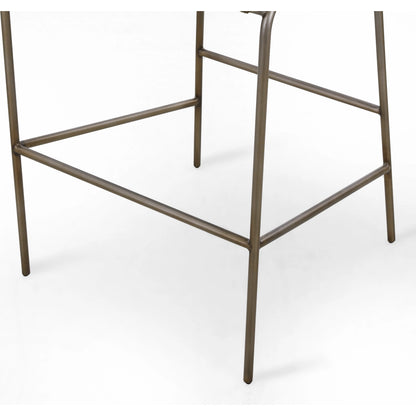 Astrud Bar Stool by Four Hands in sierra butterscotch. Made from faux leather, iron, top grain leather in a modern style.