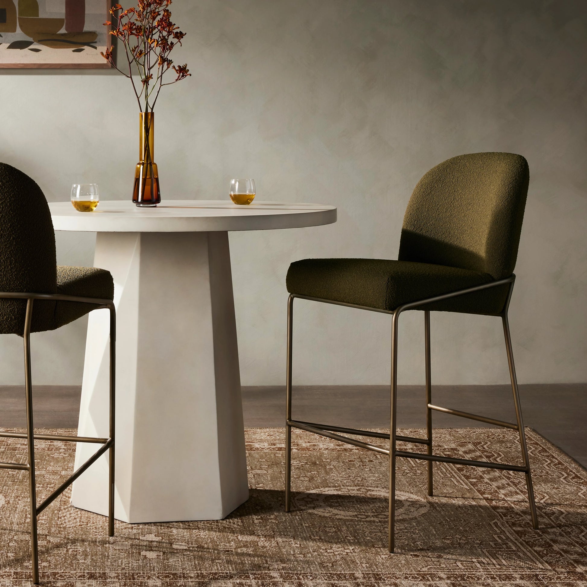 Astrud Bar Stool by Four Hands in sierra butterscotch. Made from faux leather, iron, top grain leather in a modern style.