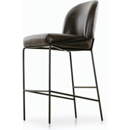 Astrud Bar Stool by Four Hands in sierra butterscotch. Made from faux leather, iron, top grain leather in a modern style.