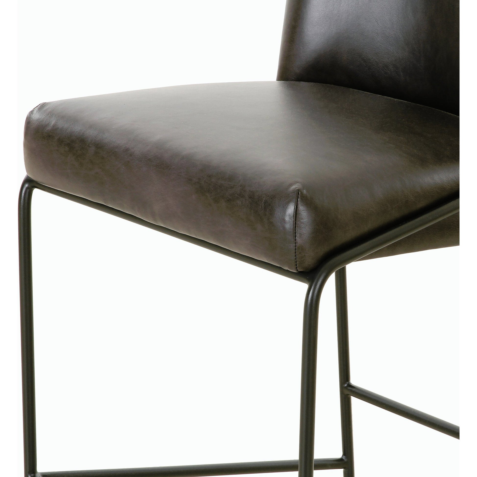 Astrud Bar Stool by Four Hands in sierra butterscotch. Made from faux leather, iron, top grain leather in a modern style.