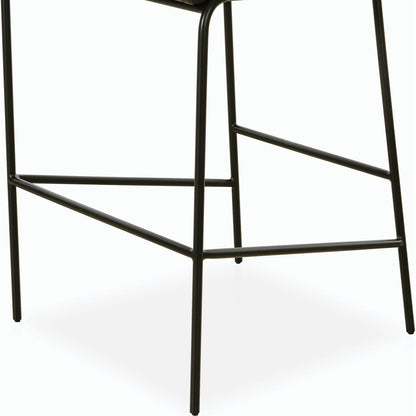 Astrud Bar Stool by Four Hands in sierra butterscotch. Made from faux leather, iron, top grain leather in a modern style.