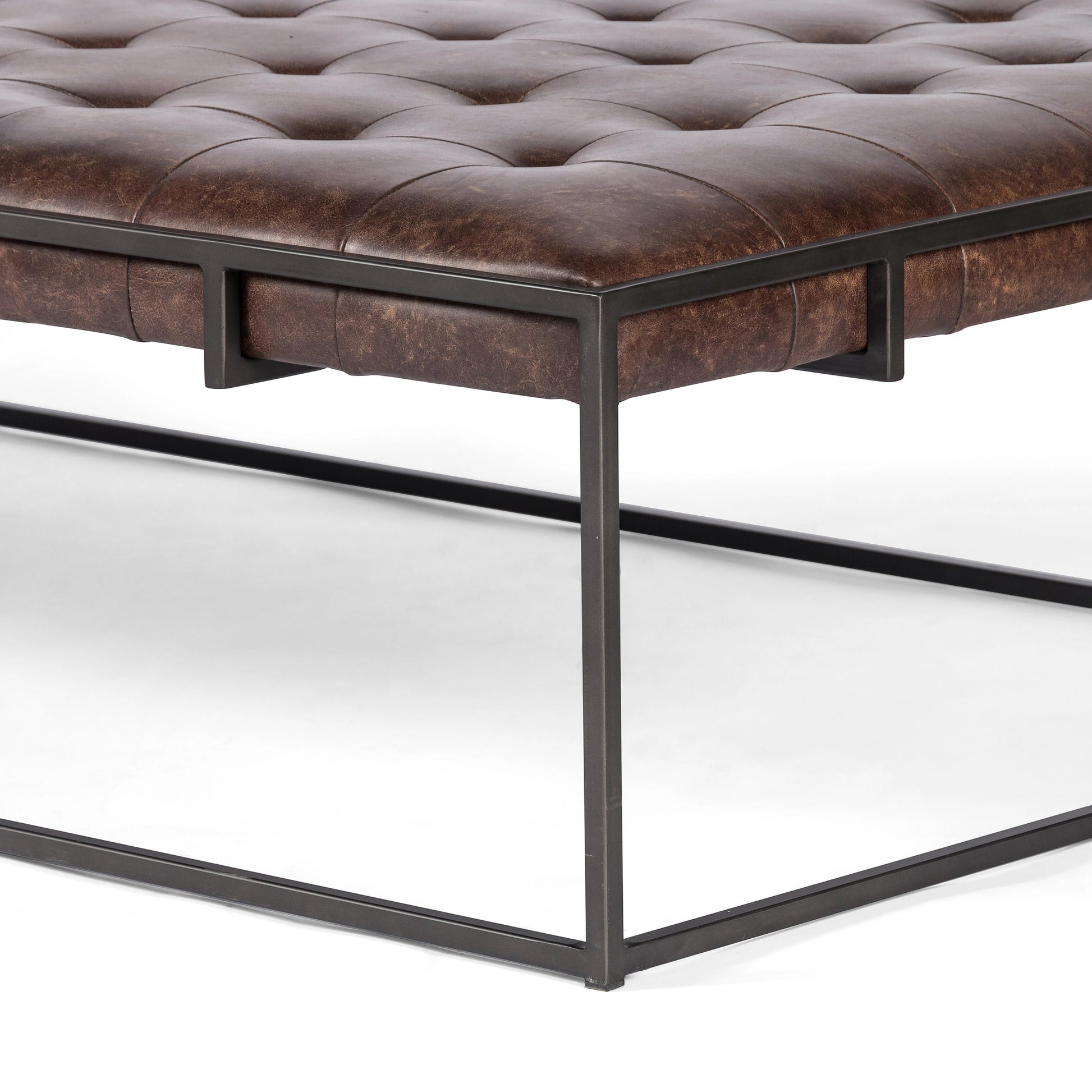 Oxford Coffee Table by Four Hands in rialto ebony and antique brass. Made from top grain leather, iron, 100% polyester in a modern style.