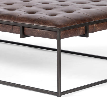 Oxford Coffee Table by Four Hands in rialto ebony and antique brass. Made from top grain leather, iron, 100% polyester in a modern style.