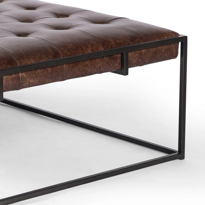 Oxford Coffee Table by Four Hands in rialto ebony and antique brass. Made from top grain leather, iron, 100% polyester in a modern style.