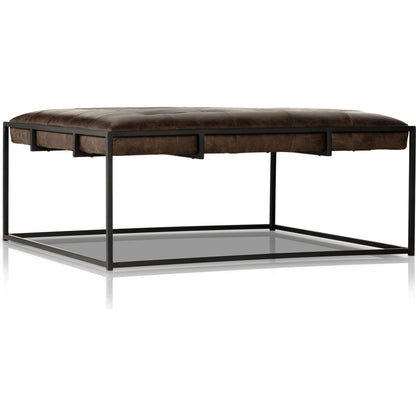 Oxford Square Coffee Table by Four Hands in rialto ebony, antique brass. Made from top grain leather, iron, 100% polyester in a modern style.