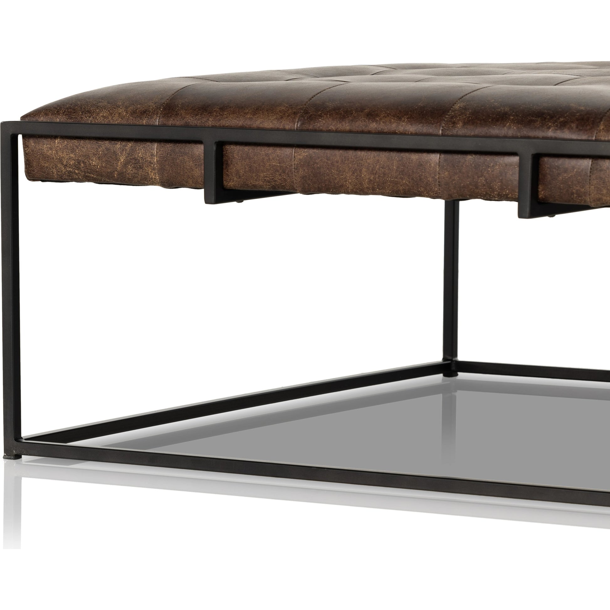 Oxford Square Coffee Table by Four Hands in rialto ebony, antique brass. Made from top grain leather, iron, 100% polyester in a modern style.