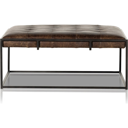 Oxford Square Coffee Table by Four Hands in rialto ebony, antique brass. Made from top grain leather, iron, 100% polyester in a modern style.