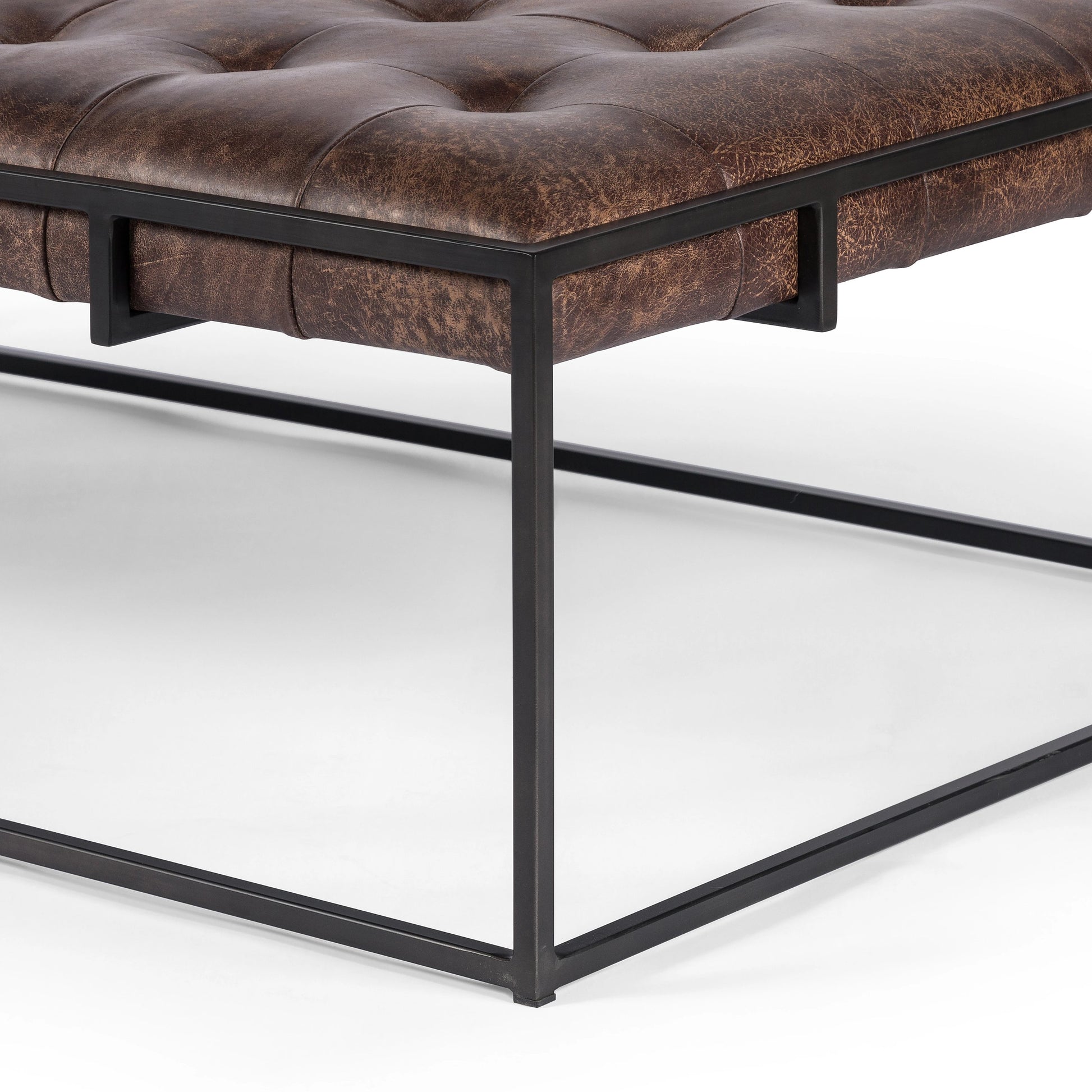 Oxford Coffee Table by Four Hands in rialto ebony and antique brass. Made from top grain leather, iron, 100% polyester in a modern style.
