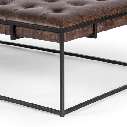 Oxford Coffee Table by Four Hands in rialto ebony and antique brass. Made from top grain leather, iron, 100% polyester in a modern style.