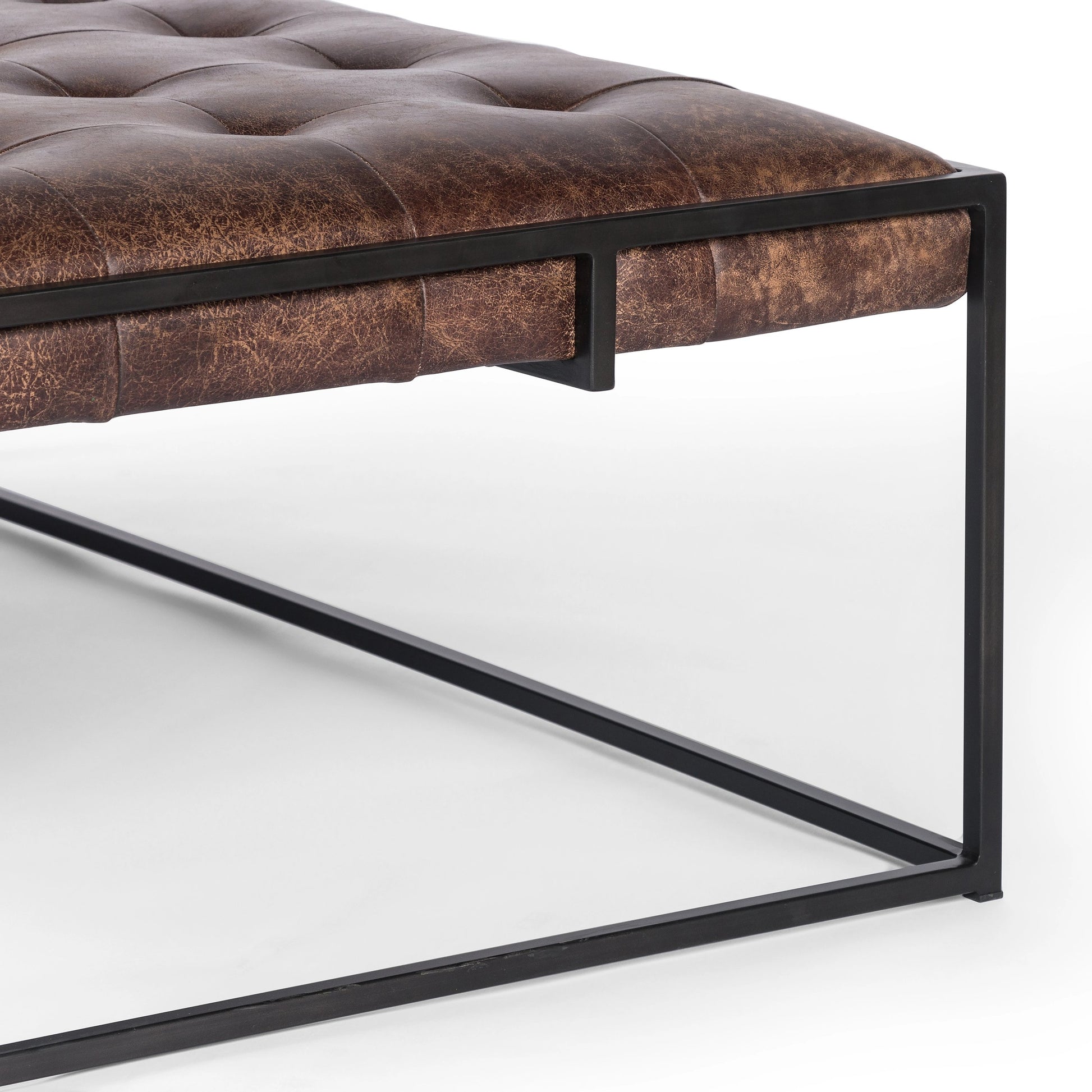 Oxford Coffee Table by Four Hands in rialto ebony and antique brass. Made from top grain leather, iron, 100% polyester in a modern style.