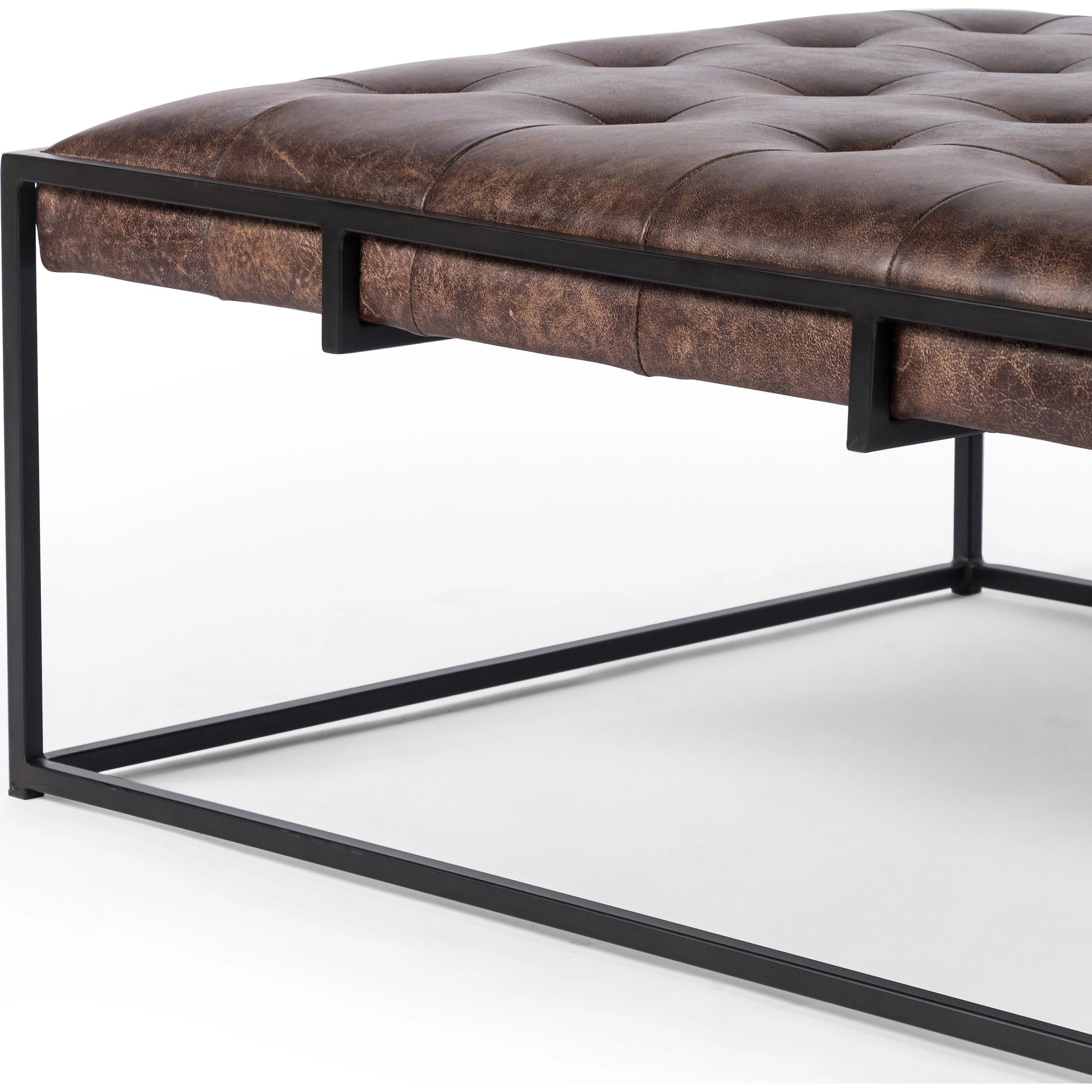 Oxford Coffee Table by Four Hands in rialto ebony and antique brass. Made from top grain leather, iron, 100% polyester in a modern style.