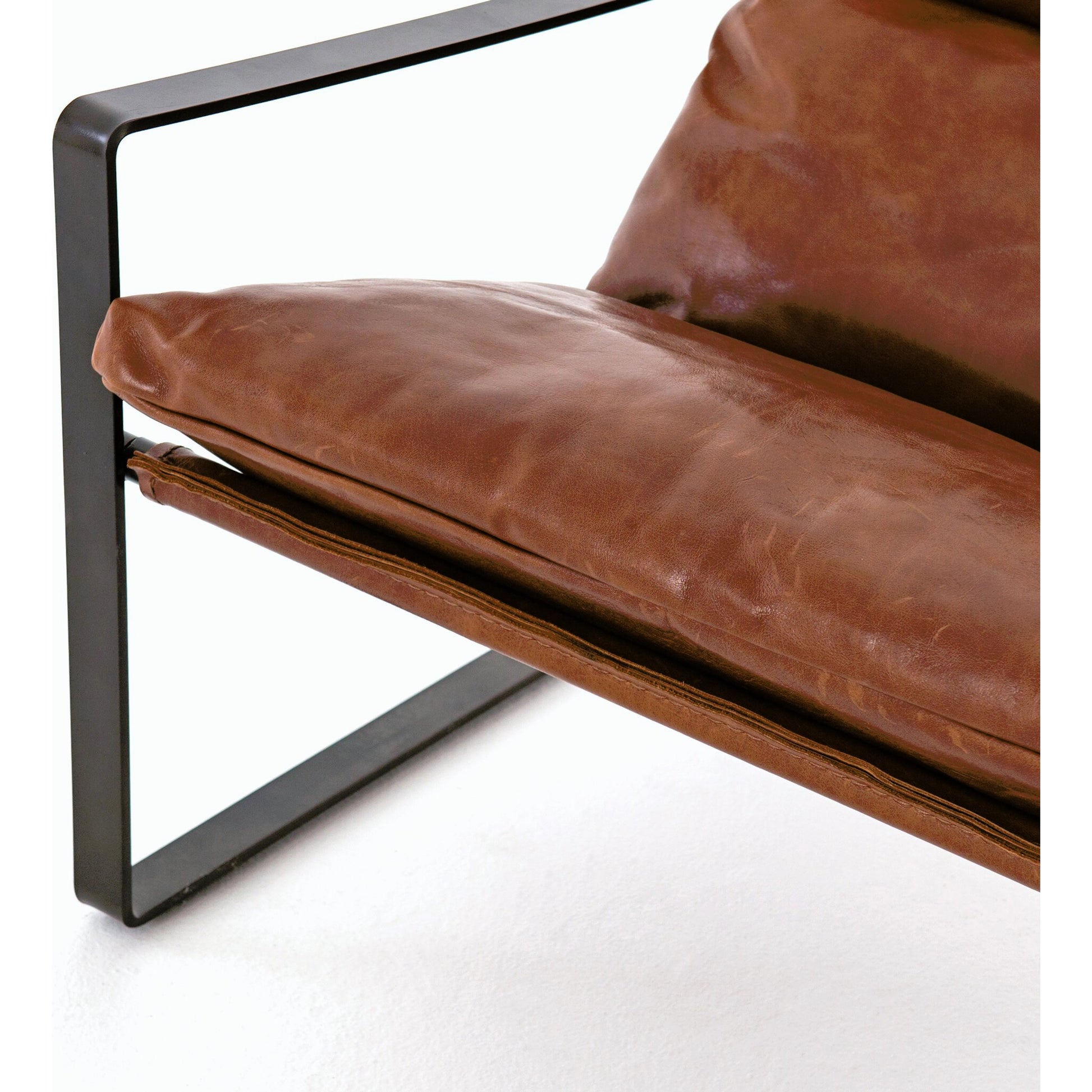 Emmett Sling Chair by Four Hands. Made from top grain leather, iron, 100% polyester in a modern style.