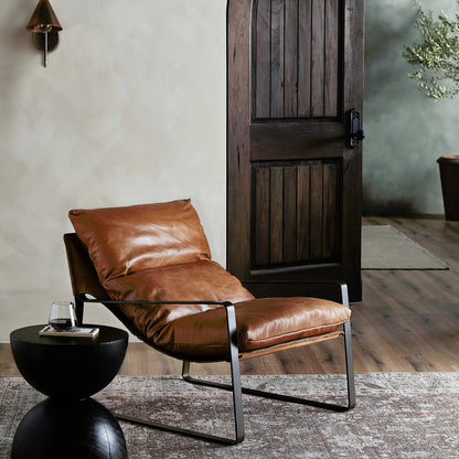 Emmett Sling Chair by Four Hands. Made from top grain leather, iron, 100% polyester in a modern style.