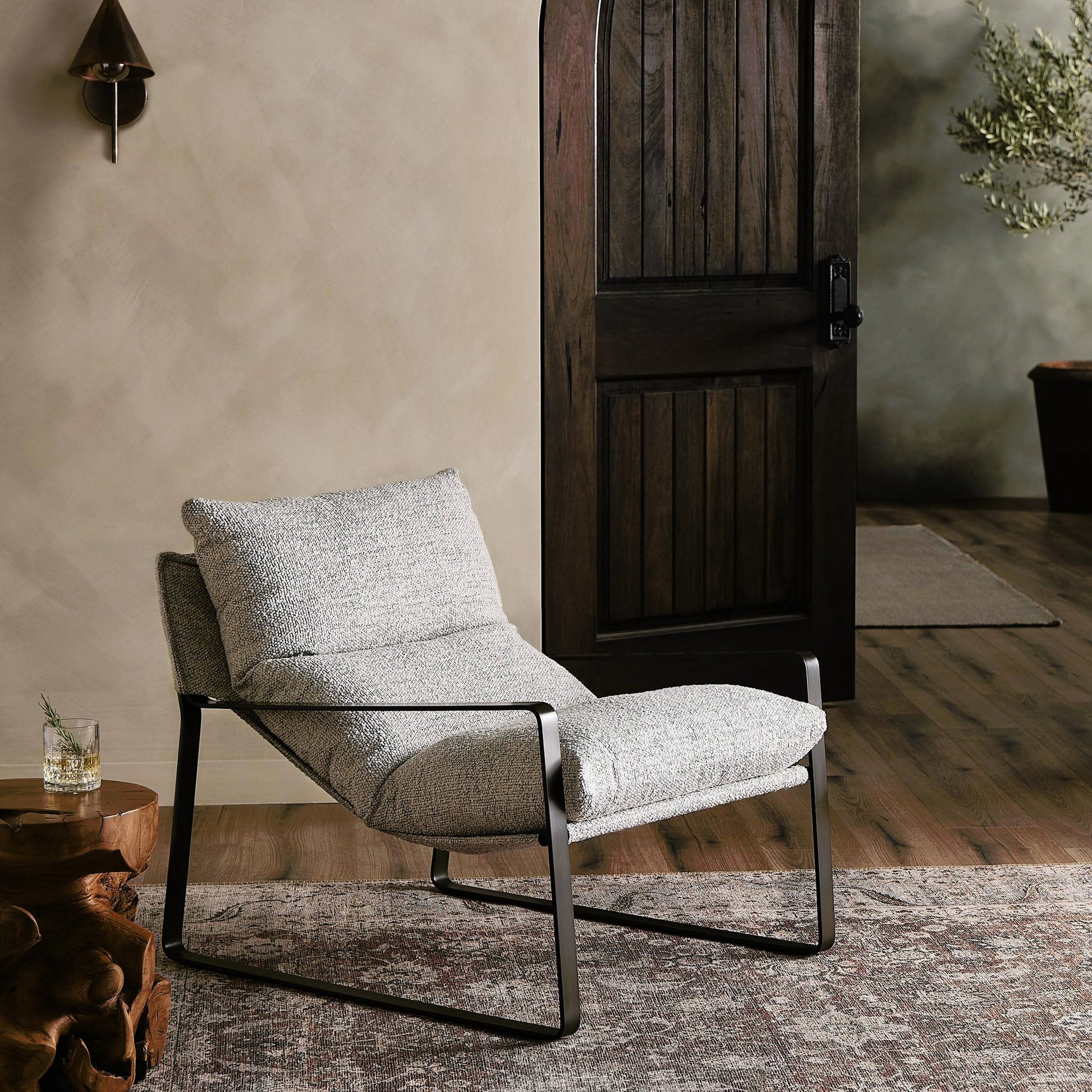 Emmett Sling Chair by Four Hands. Made from top grain leather, iron, 100% polyester in a modern style.