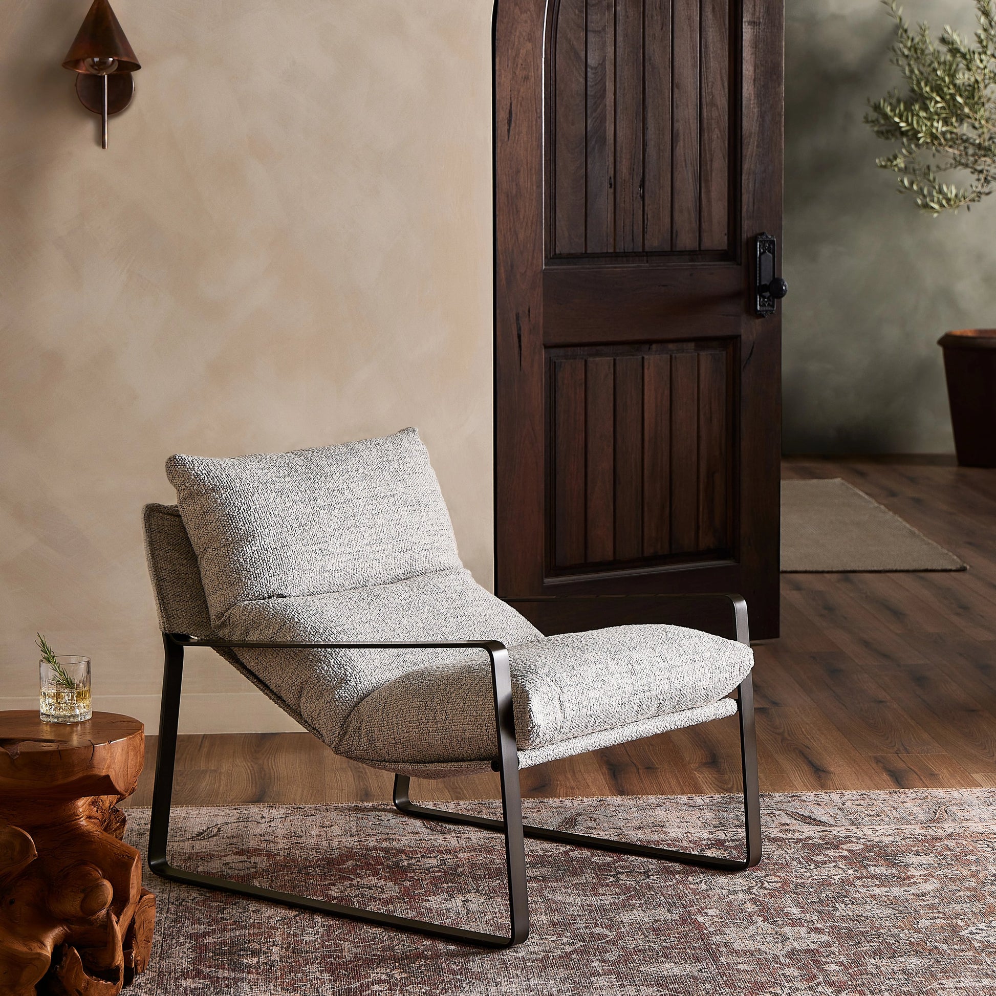 Emmett Sling Chair by Four Hands. Made from top grain leather, iron, 100% polyester in a modern style.