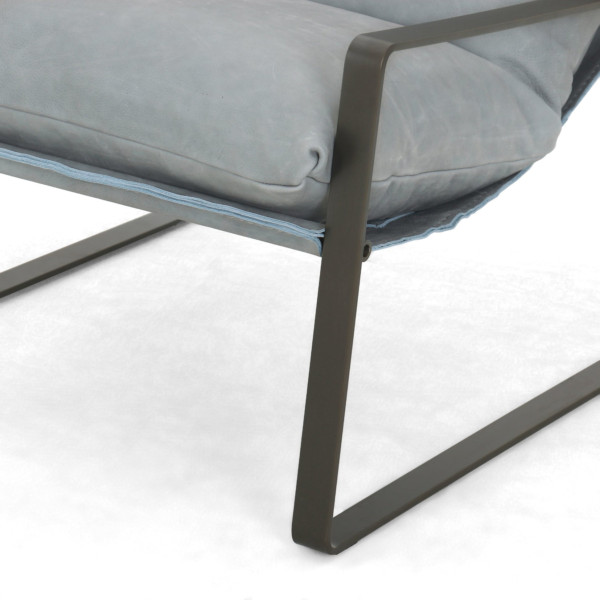 Emmett Sling Chair by Four Hands. Made from top grain leather, iron, 100% polyester in a modern style.