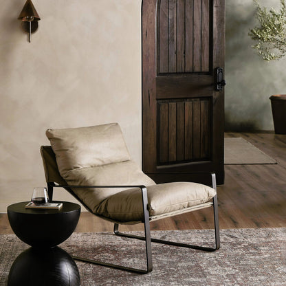 Emmett Sling Chair by Four Hands. Made from top grain leather, iron, 100% polyester in a modern style.