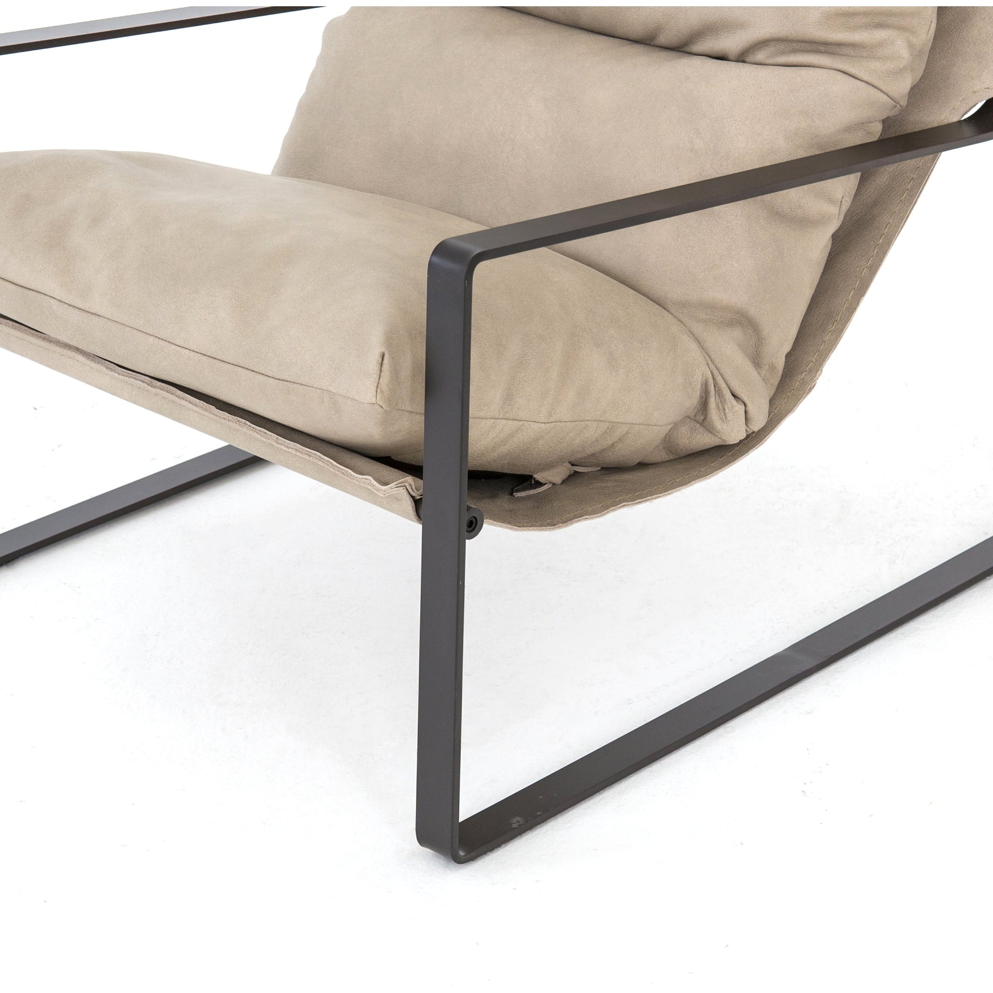 Emmett Sling Chair by Four Hands. Made from top grain leather, iron, 100% polyester in a modern style.