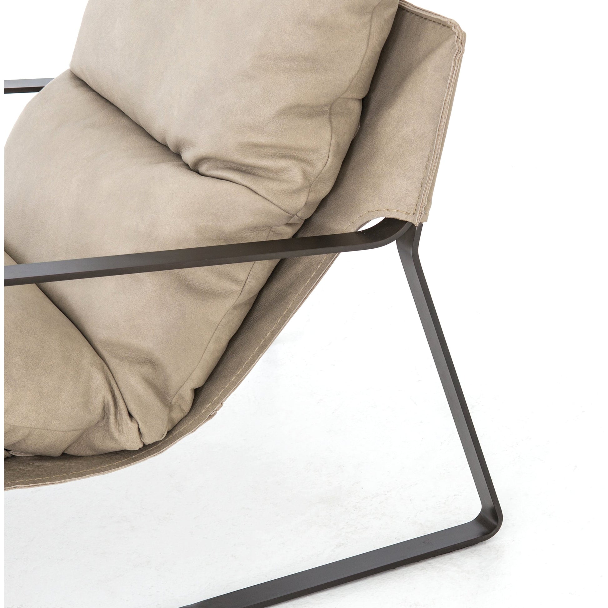 Emmett Sling Chair by Four Hands. Made from top grain leather, iron, 100% polyester in a modern style.
