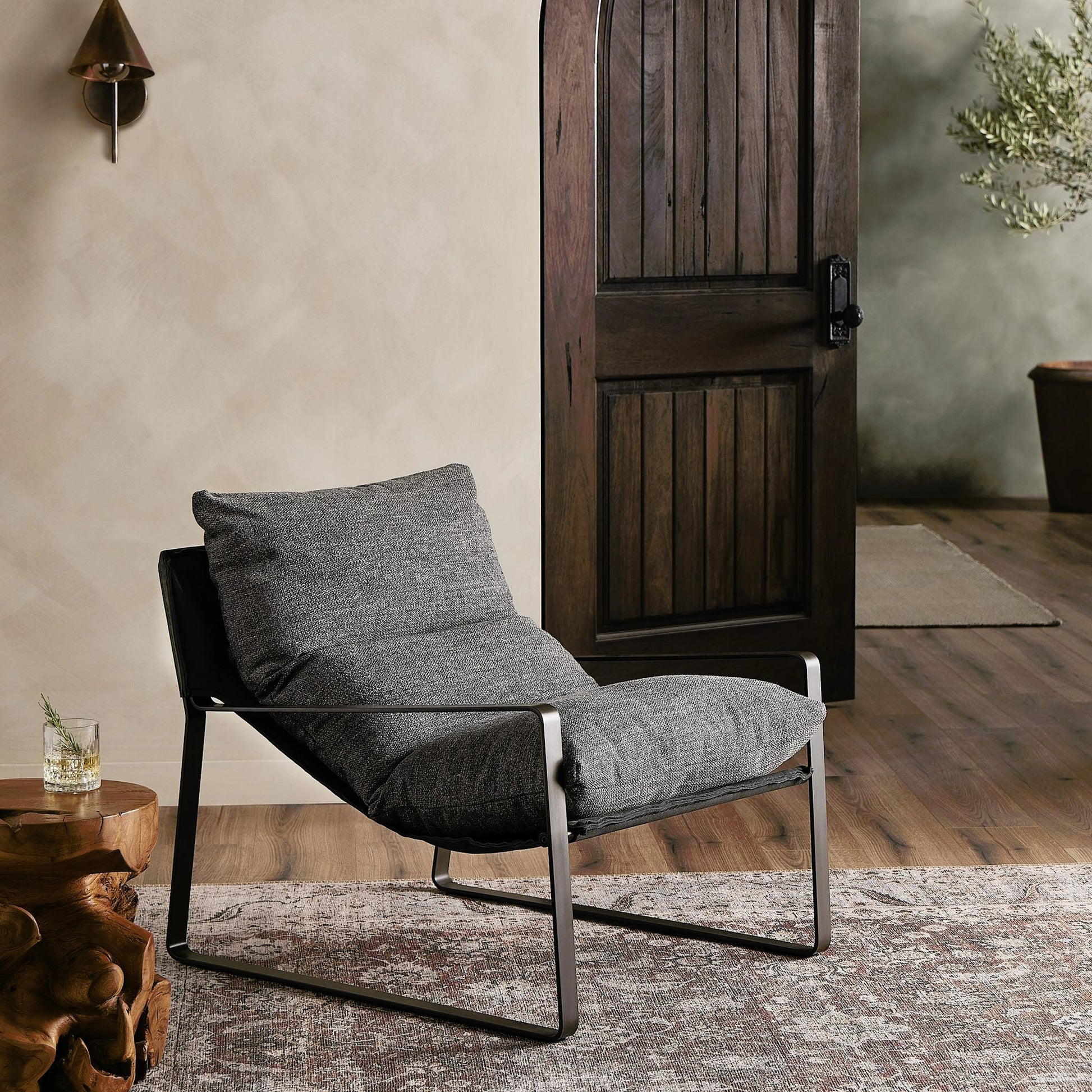 Emmett Sling Chair by Four Hands. Made from top grain leather, iron, 100% polyester in a modern style.