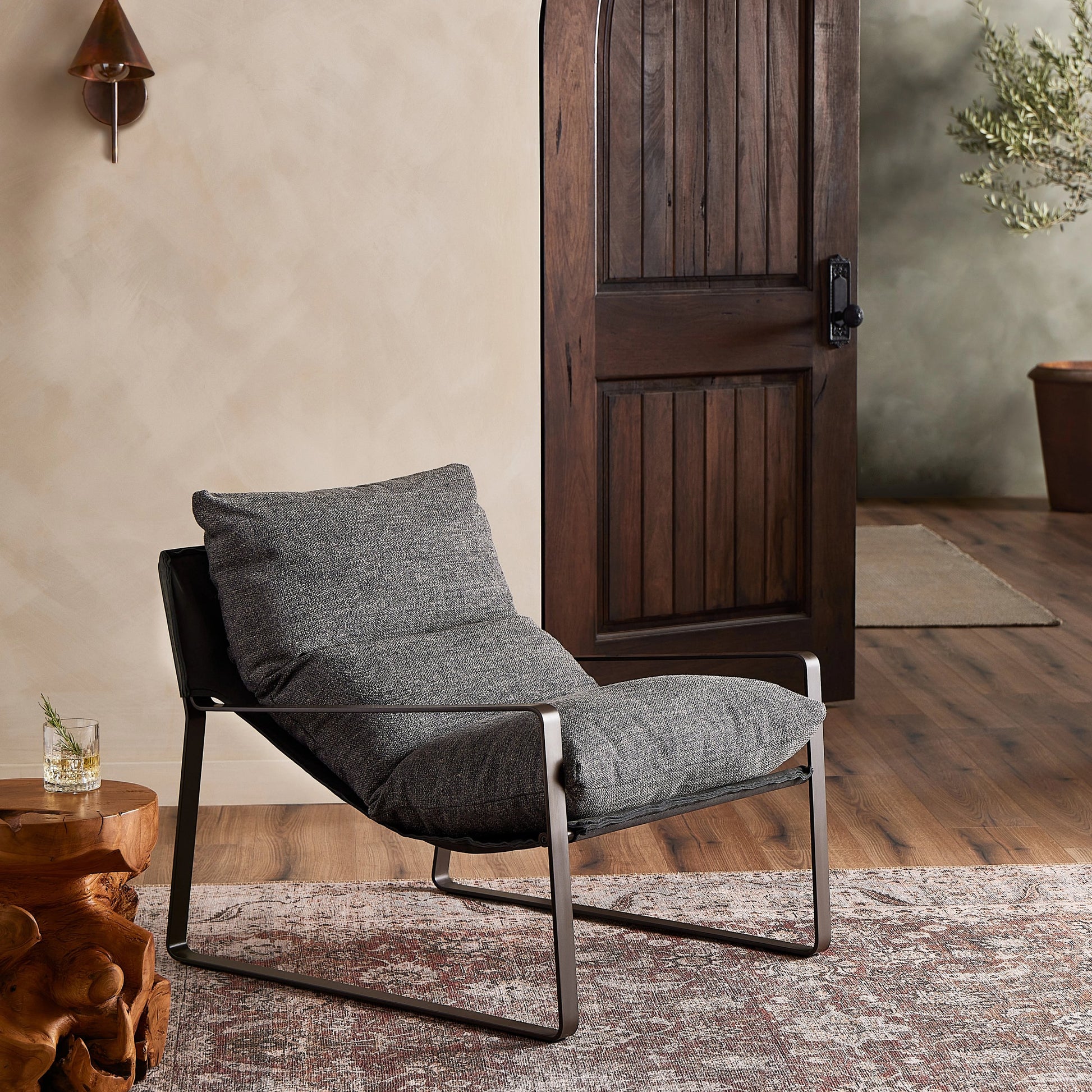 Emmett Sling Chair by Four Hands. Made from top grain leather, iron, 100% polyester in a modern style.