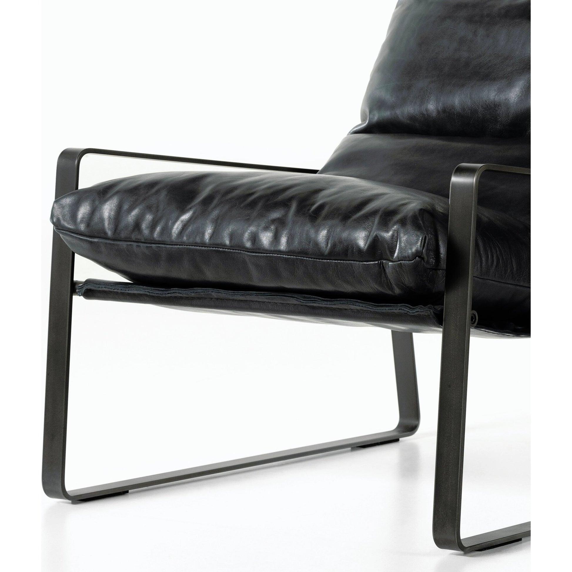 Emmett Sling Chair by Four Hands. Made from top grain leather, iron, 100% polyester in a modern style.