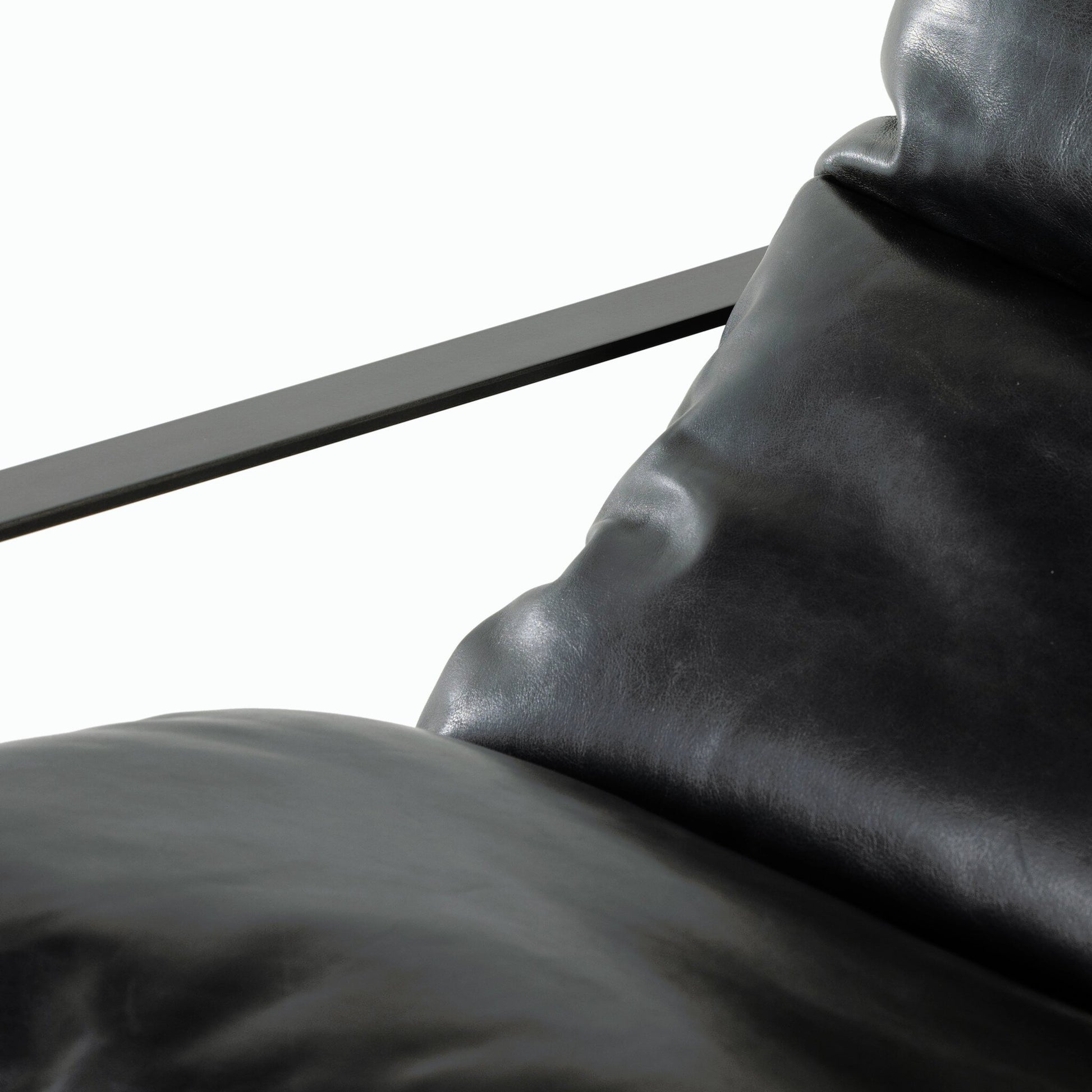 Emmett Sling Chair by Four Hands. Made from top grain leather, iron, 100% polyester in a modern style.