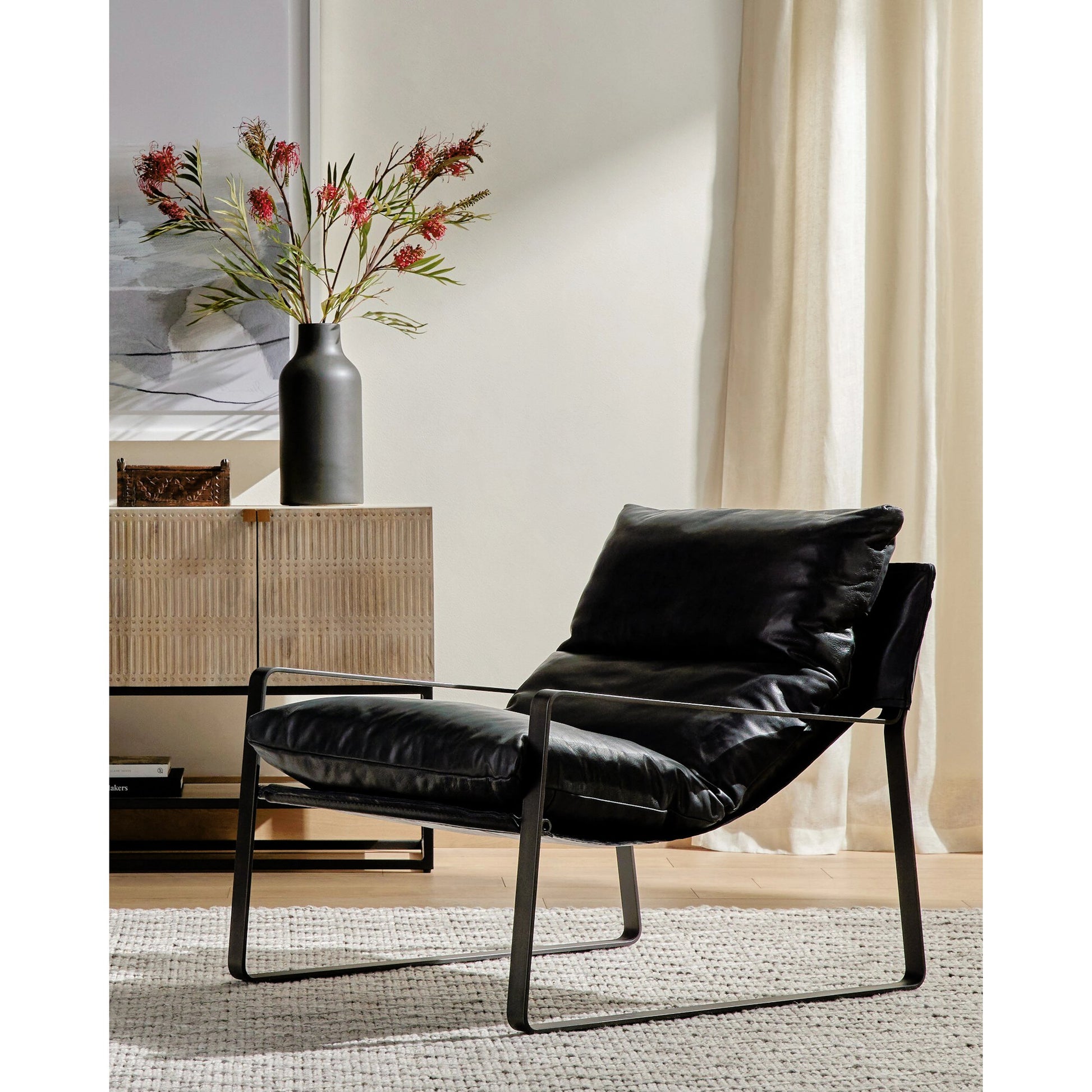 Emmett Sling Chair by Four Hands. Made from top grain leather, iron, 100% polyester in a modern style.