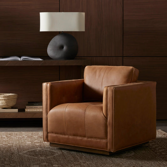 Kiera Swivel Chair by Four Hands. Made from top grain leather, solid parawood, pine plywood in a transitional style.